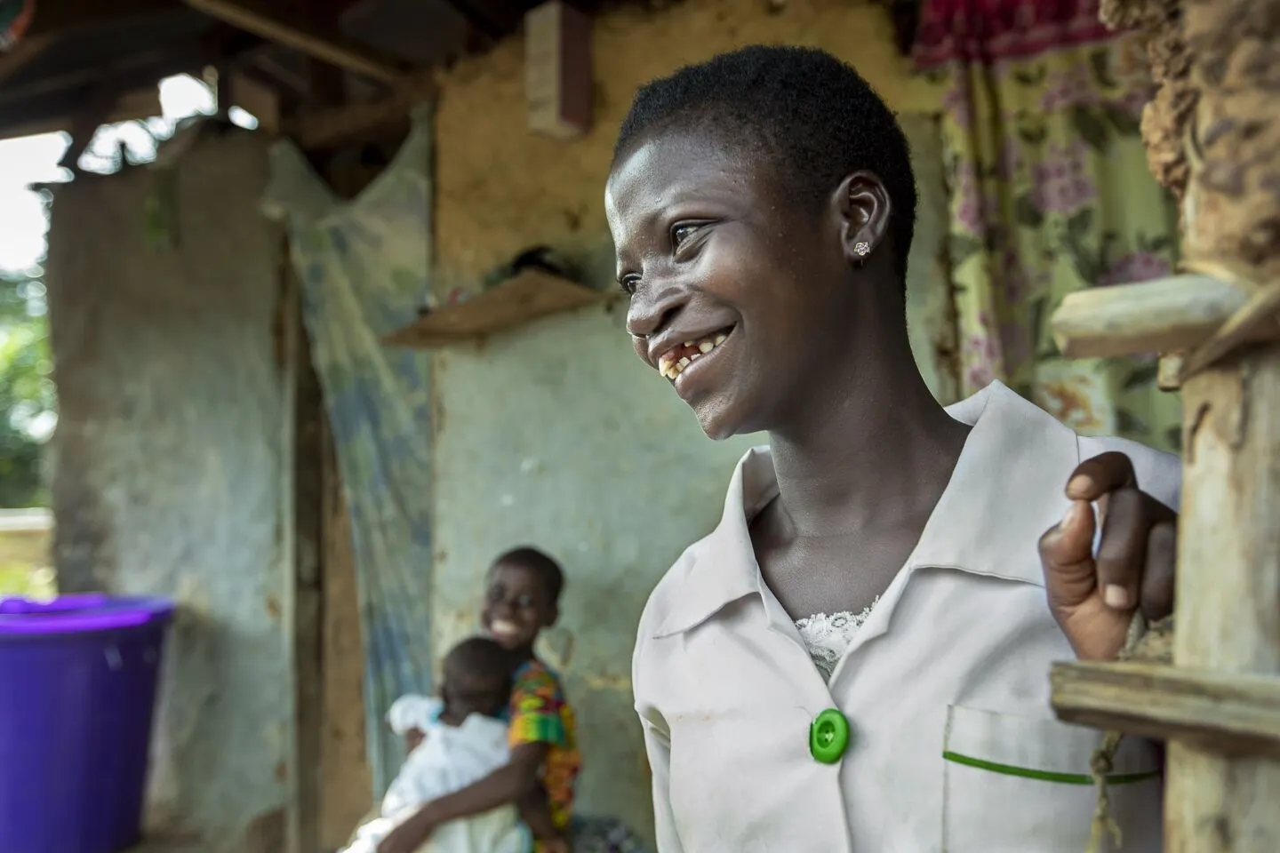 Faustina looks on, smiling, after surgery.
