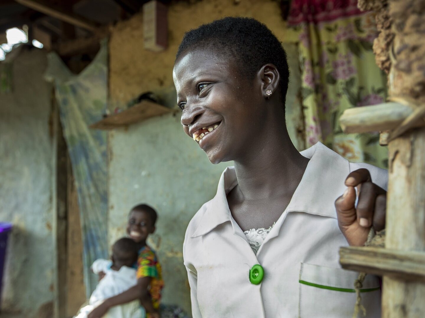 Faustina looks on, smiling, after surgery.