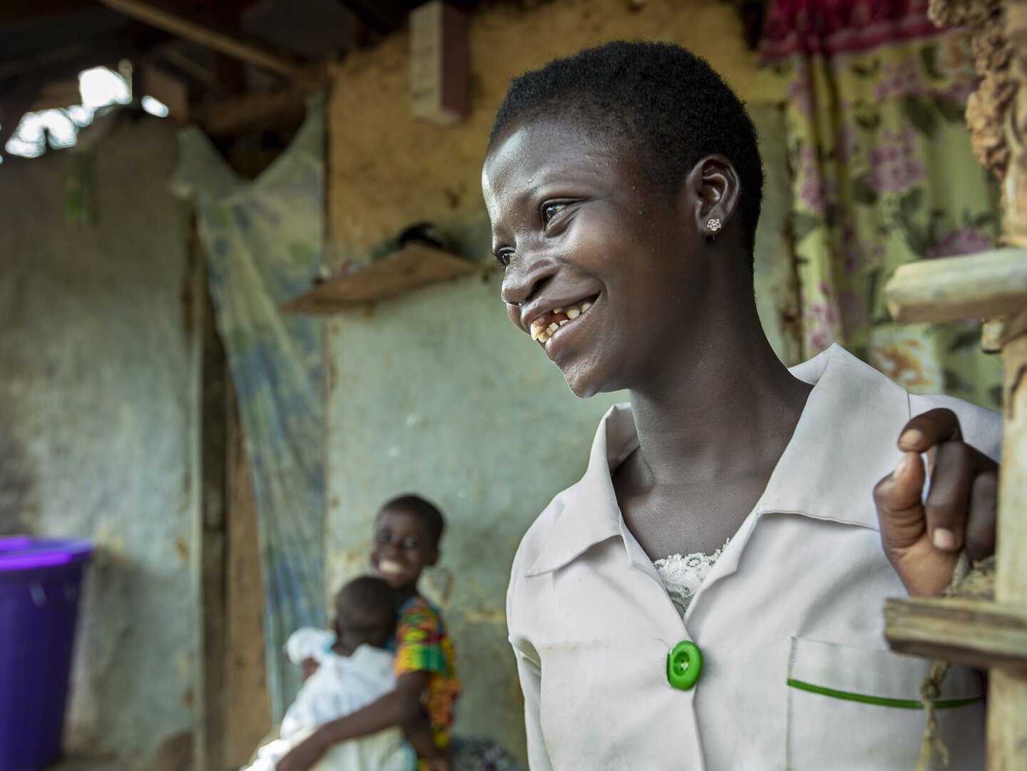 Faustina looks on, smiling, after surgery.