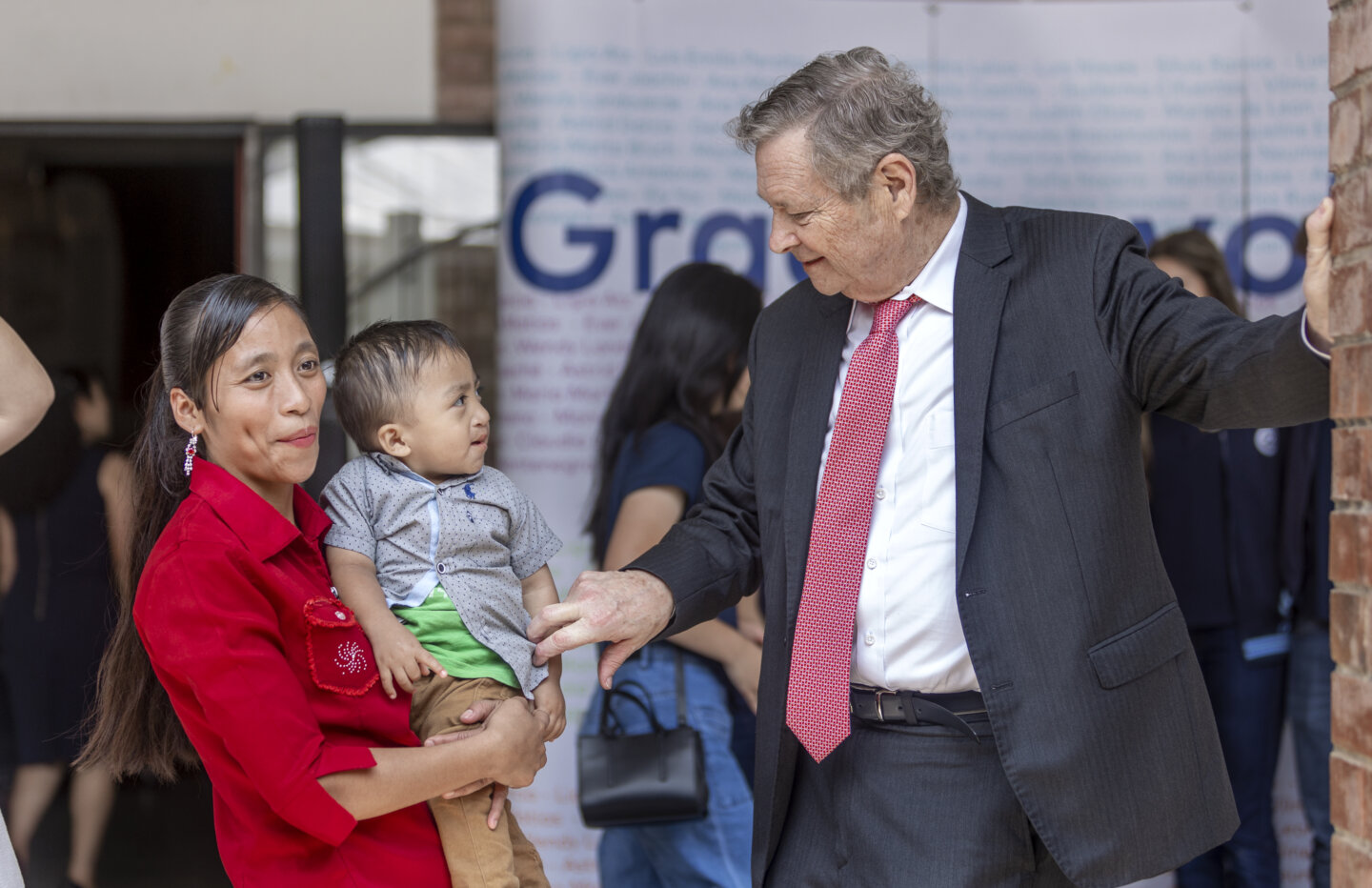 During the center’s inauguration, Dr. Bill Magee shares a sweet moment with Jobito and his mother, Lilia. Jobito received his new smile during a May 2022 surgical program.