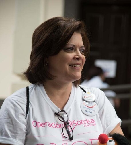 Gloria Vilches holds toys and supplies that she uses during her speech therapy sessions with Operation Smile patients.