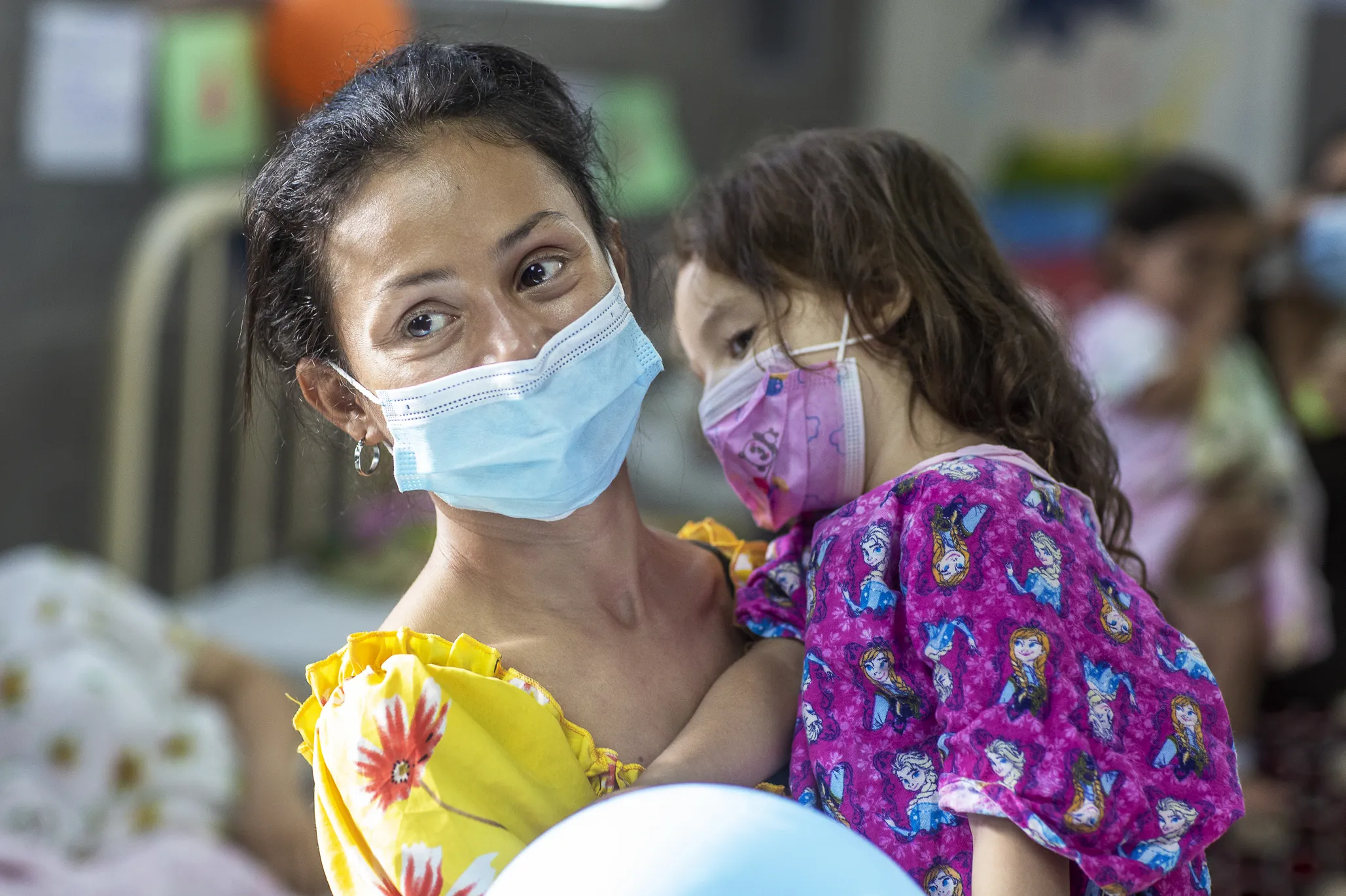 Ana, holds her daughter, Zoe, in the pre-operative ward during an Operation Smile Honduras surgical program.