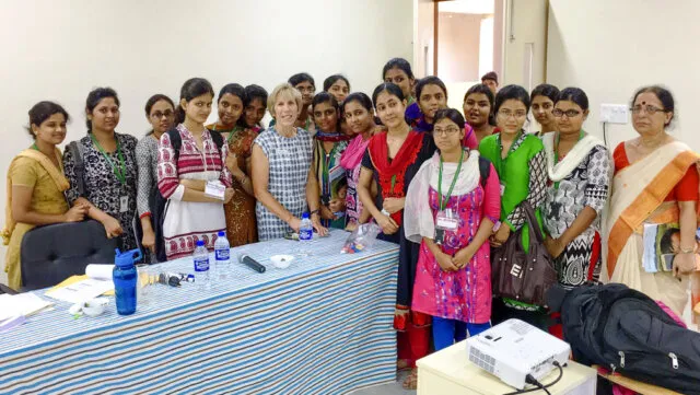 Operation Smile volunteer nurse educator Linda Bucher, seventh from left, poses with participants of the Future of Smiles surgical program nursing education workshop.
