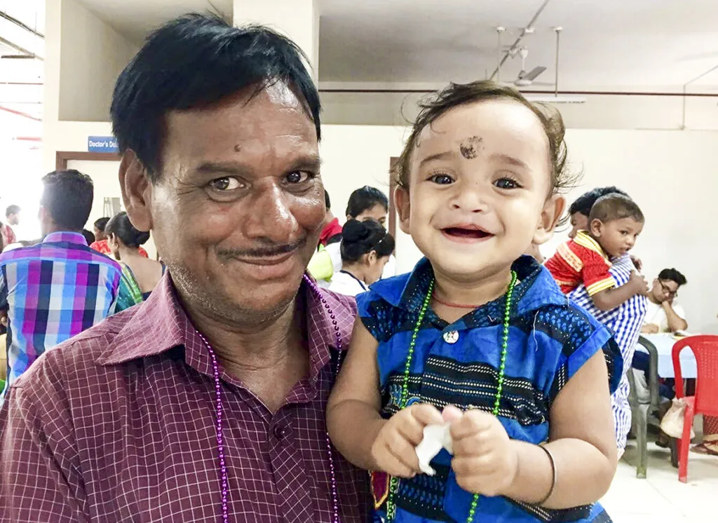 Eleven-month-old Ankan, pictured here with his father on screening day.