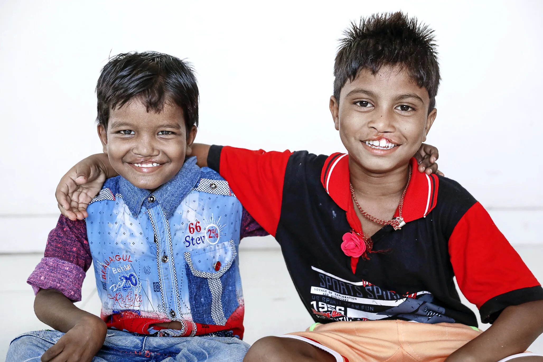 Seven-year-old Monu and Bipul pose for a photo during patient announcement day.