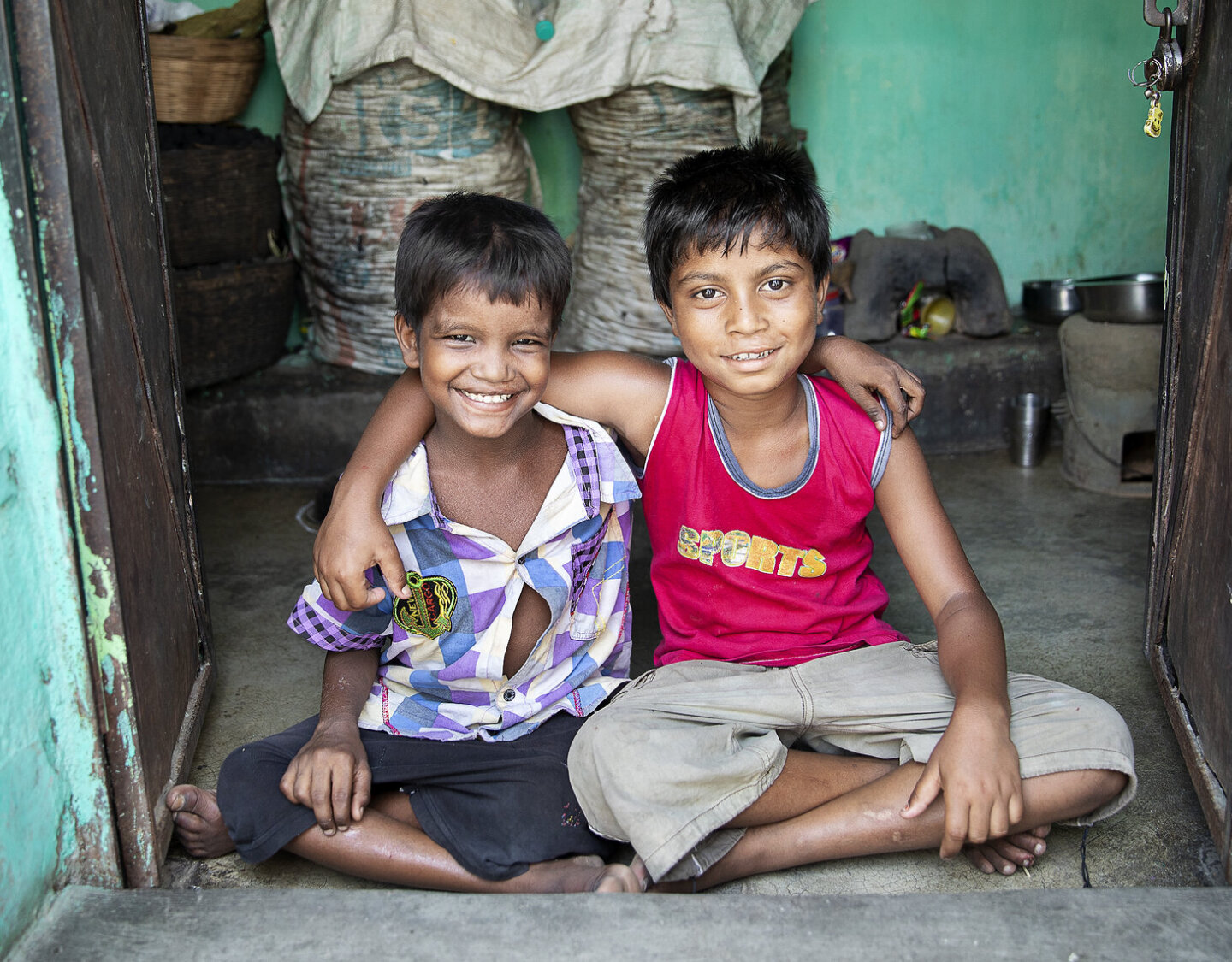 Monu and Bipul smile for the camera, one year after receiving surgery from Operation Smile.