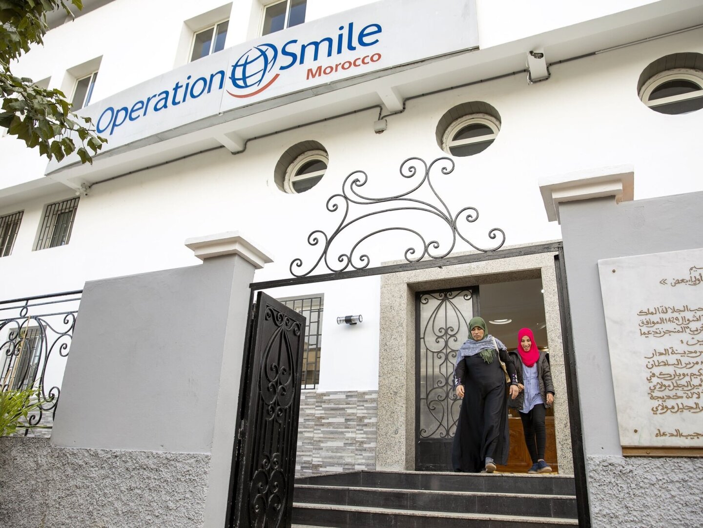 Siham and her mother exit the Operation Smile Morocco care center in Casablanca.