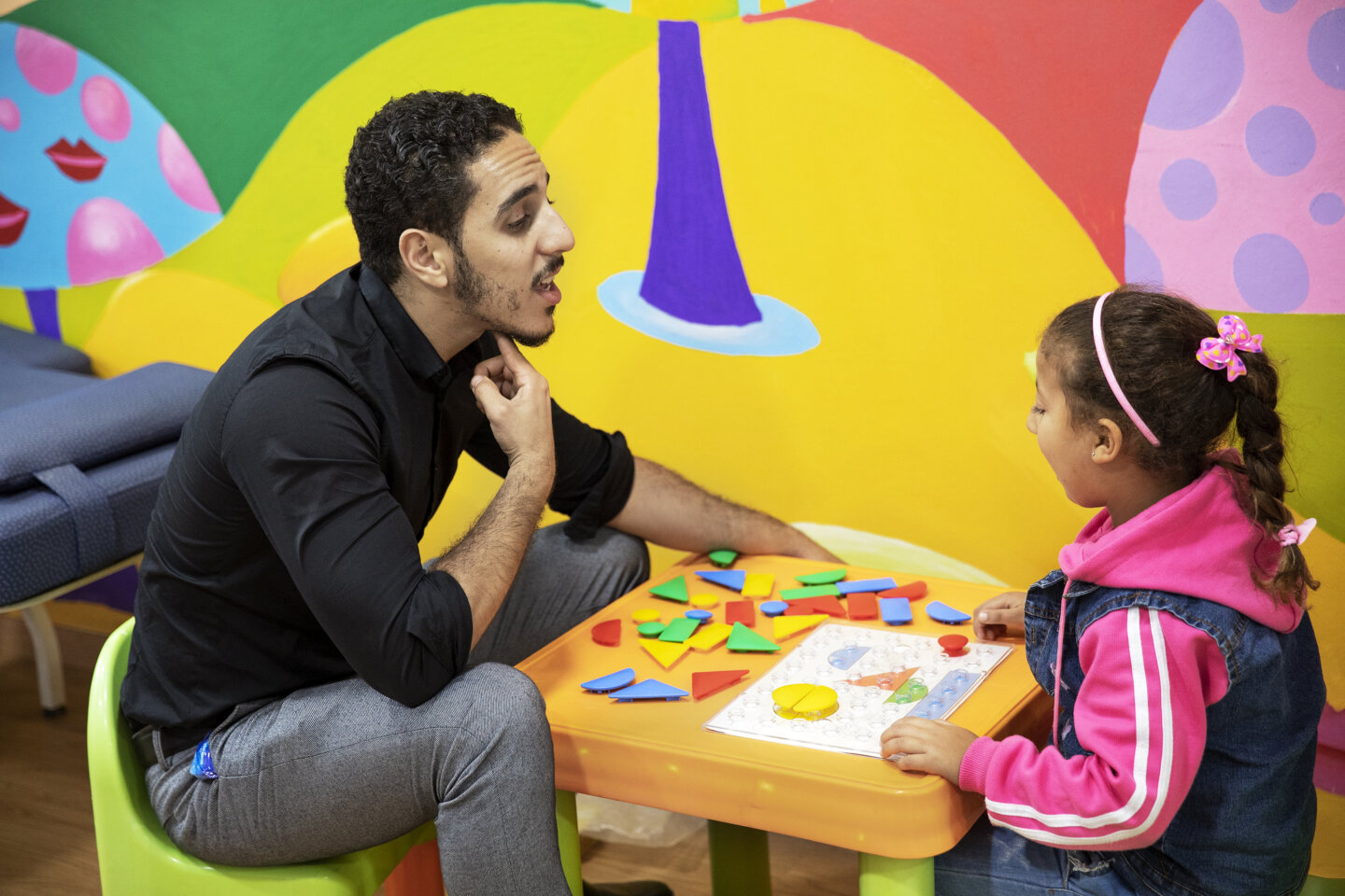 Volunteer speech therapist Othman El Hammouni during a therapy session with patient at the care center in Casablanca.