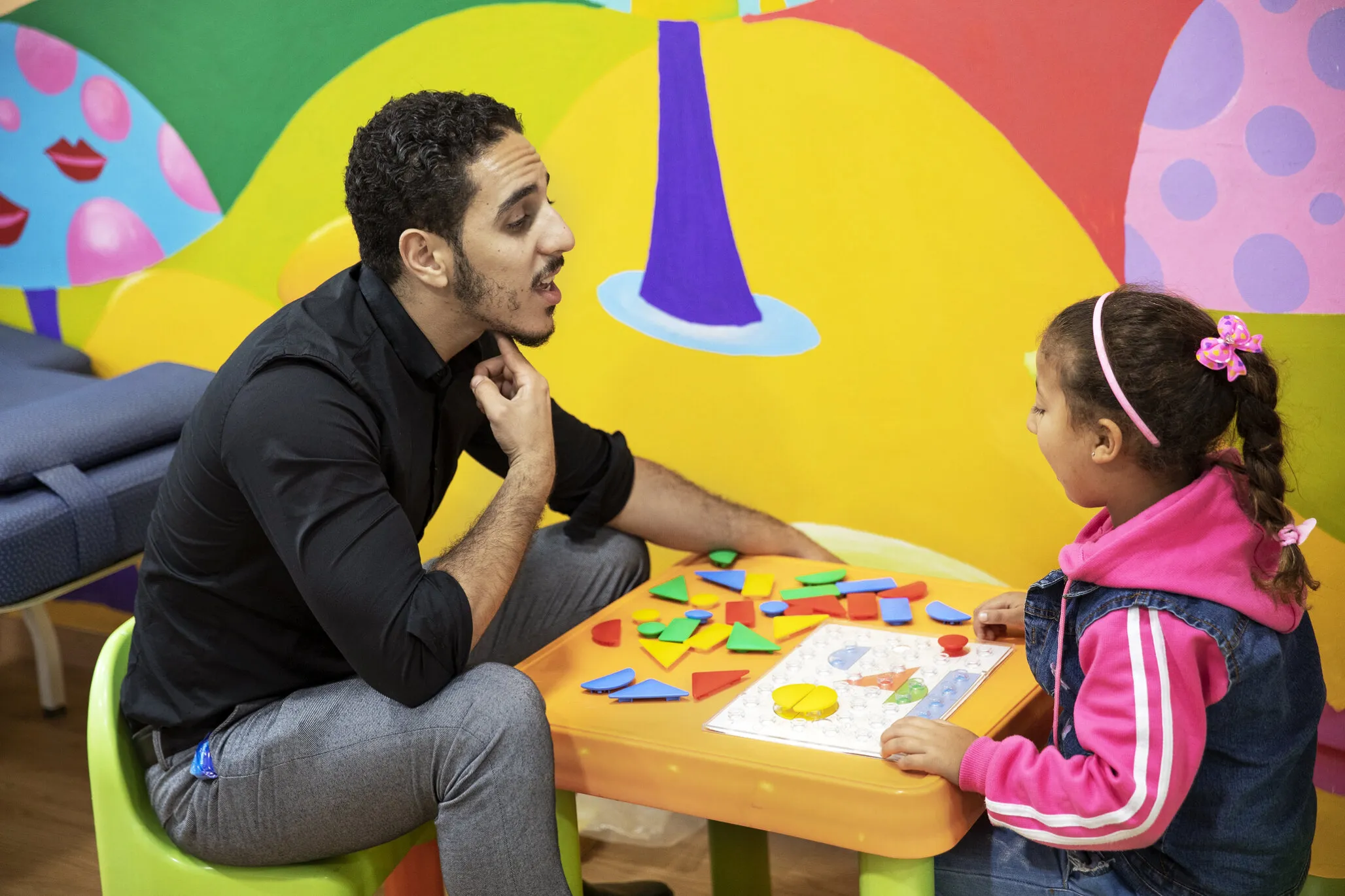 Volunteer speech therapist Othman El Hammouni during a therapy session with patient at the care center in Casablanca.