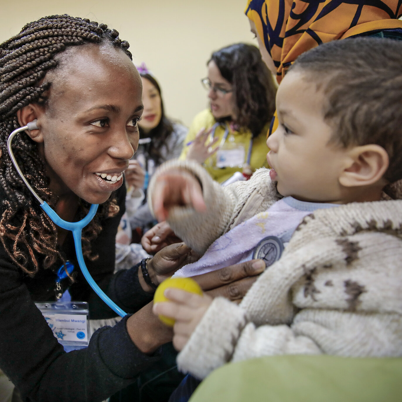 An Operation Smile volunteer examines a patient during a surgical program in Morocco.