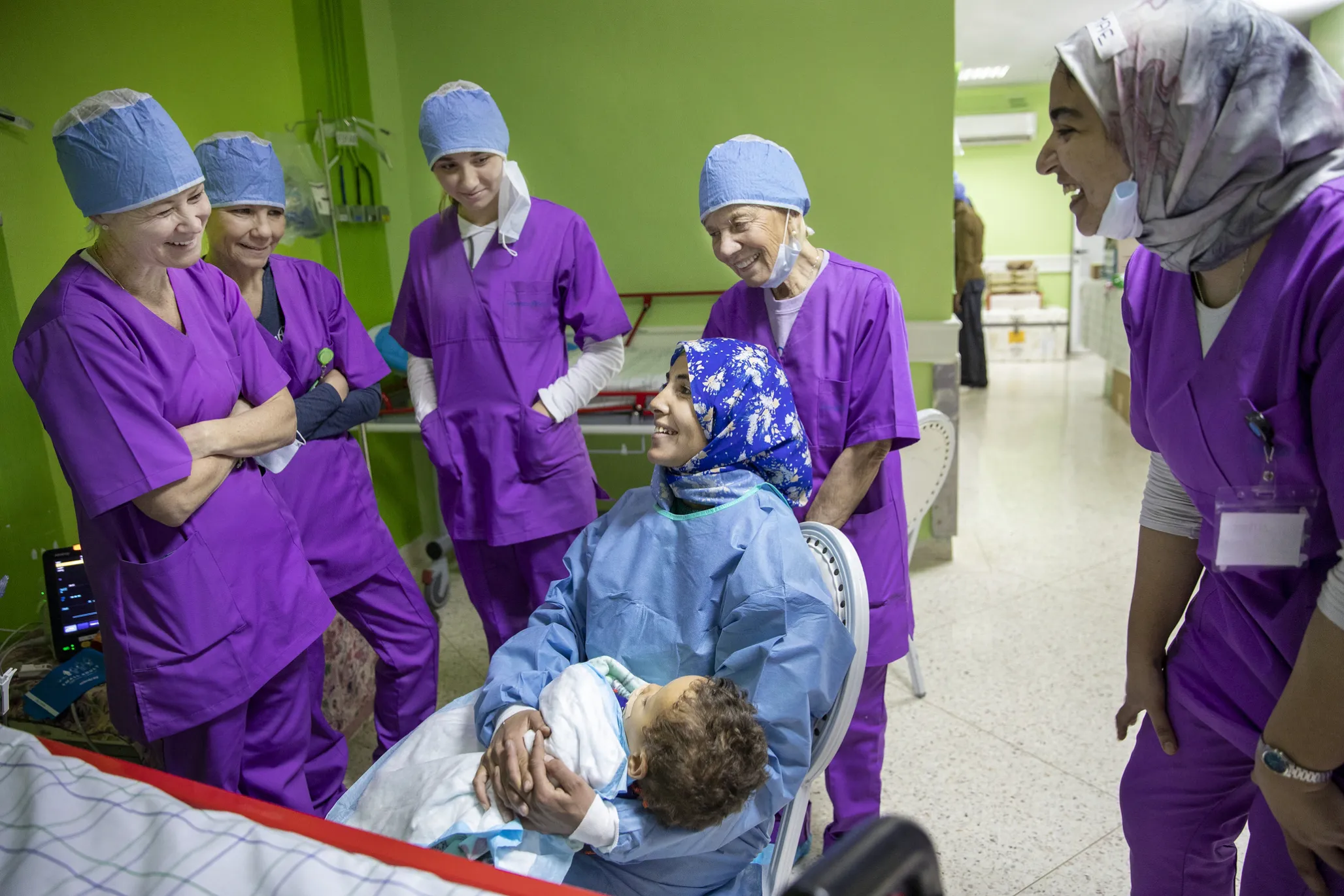 During a 2020 surgical program in Oujda, Morocco, Kristie Magee Porcaro, left, Brigette Magee Clifford, Brigette's daughter Isabelle and Kathy Magee share a happy moment with the mother of 18-month-old Brahim following surgery.