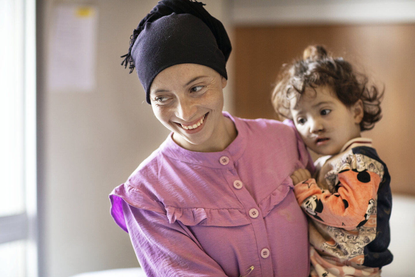 Fatima is filled with happiness and joy as she holds Janat after the surgery that repaired her daughter’s cleft lip.