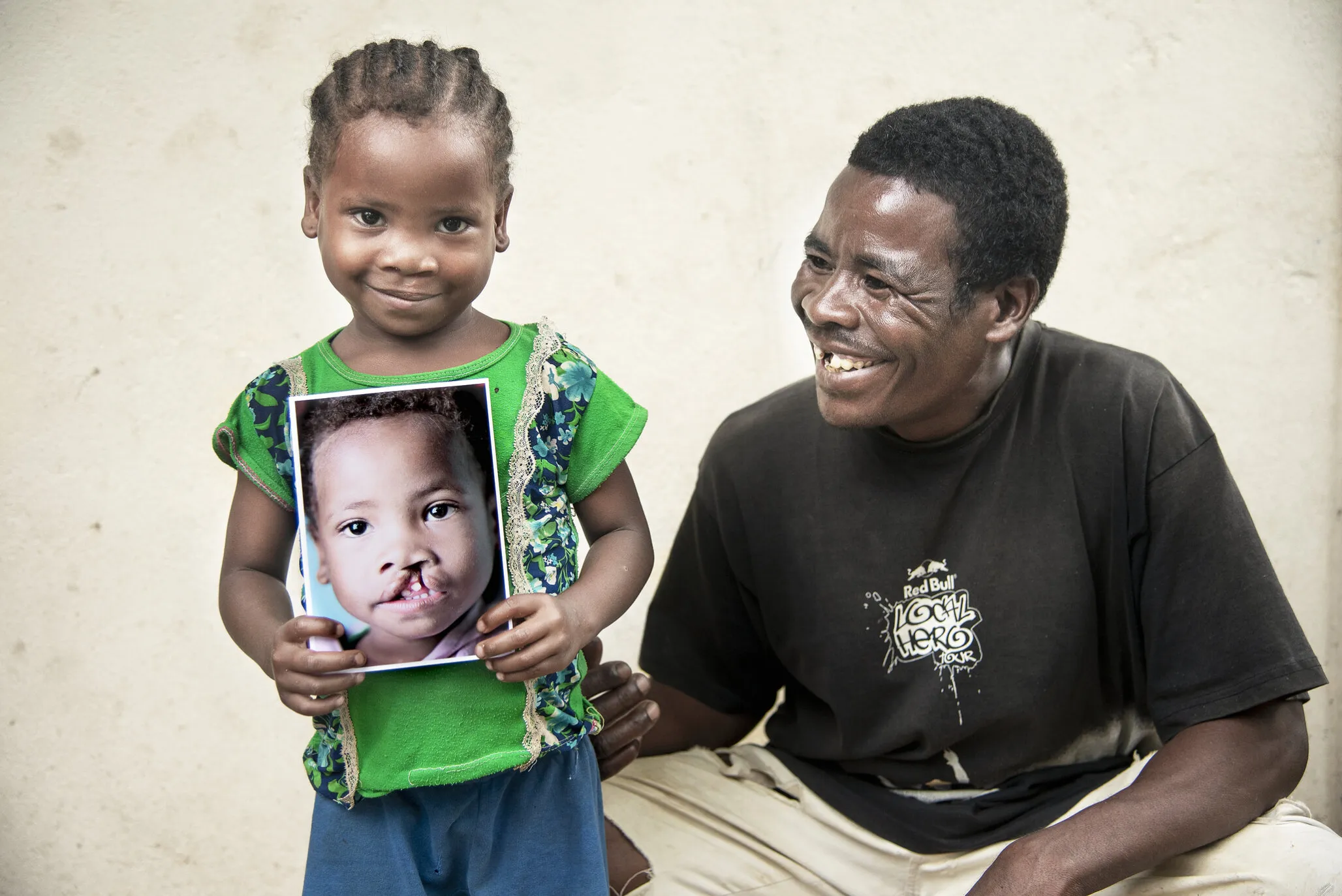 Brunel and her father smile with her before photo.
