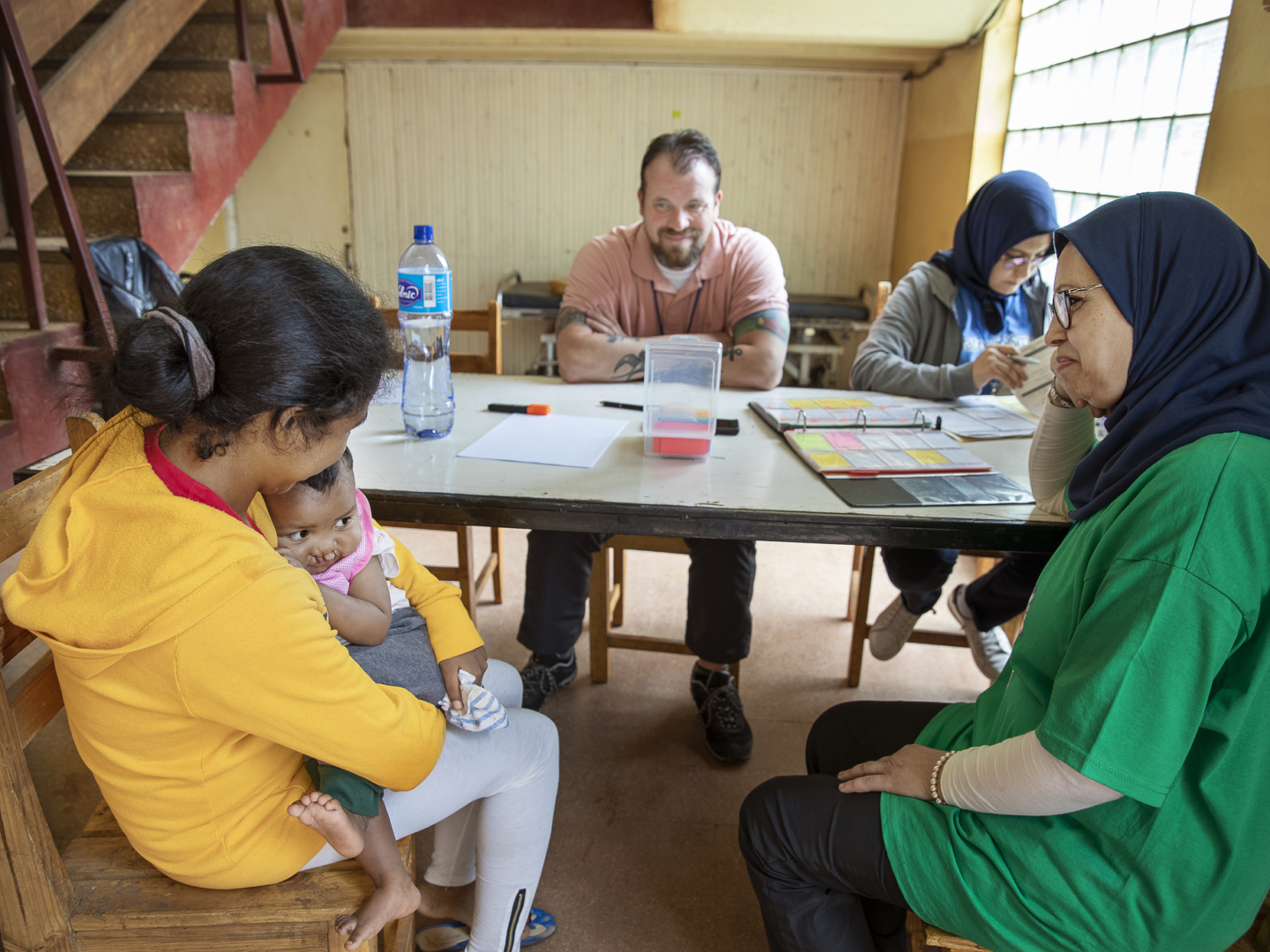 Brian Zimmerman speaks with patients and families during a surgical program in Madagascar.