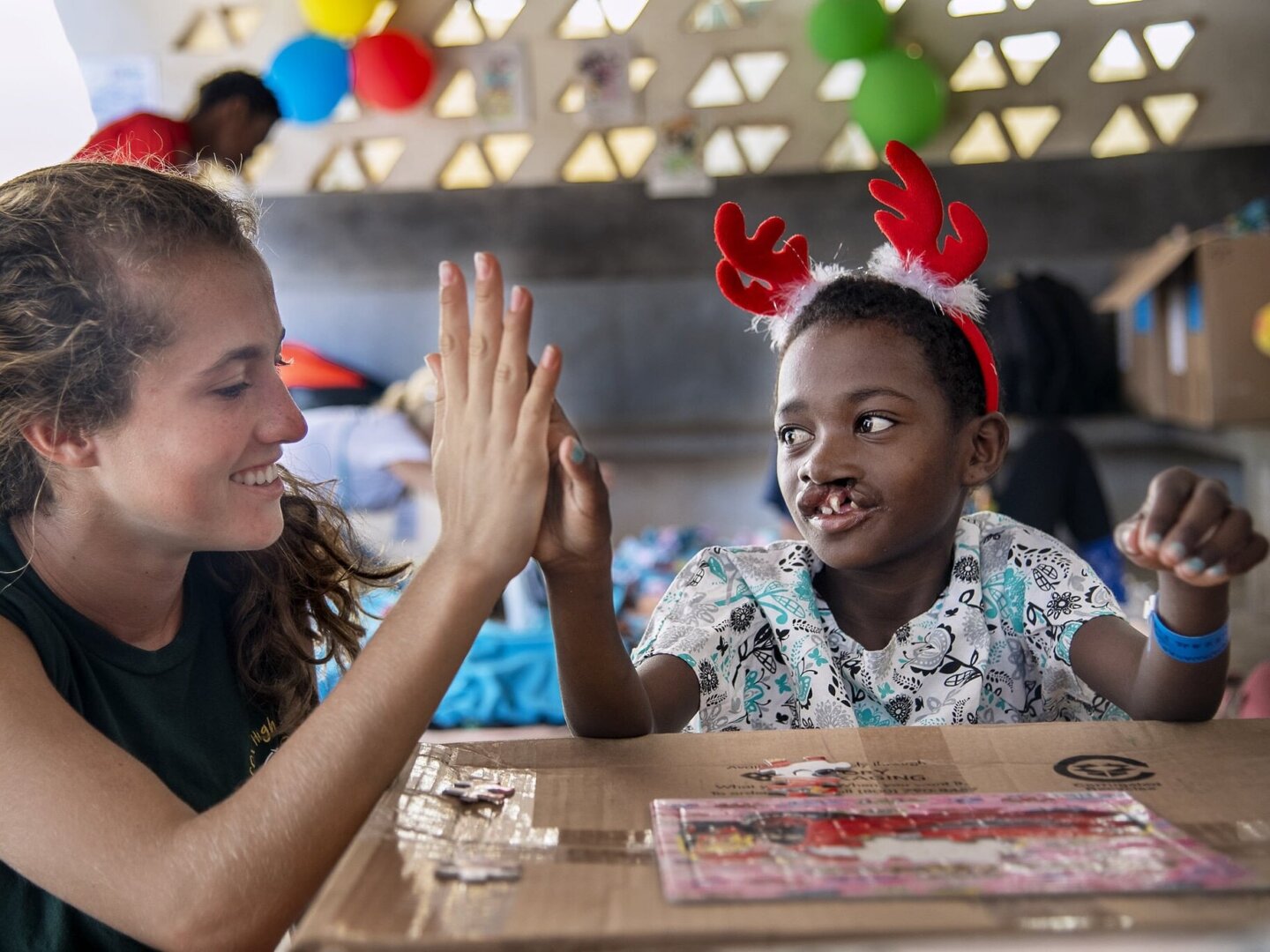 Tiaviniaina works on a puzzle during a program in Majunga, Madgascar.