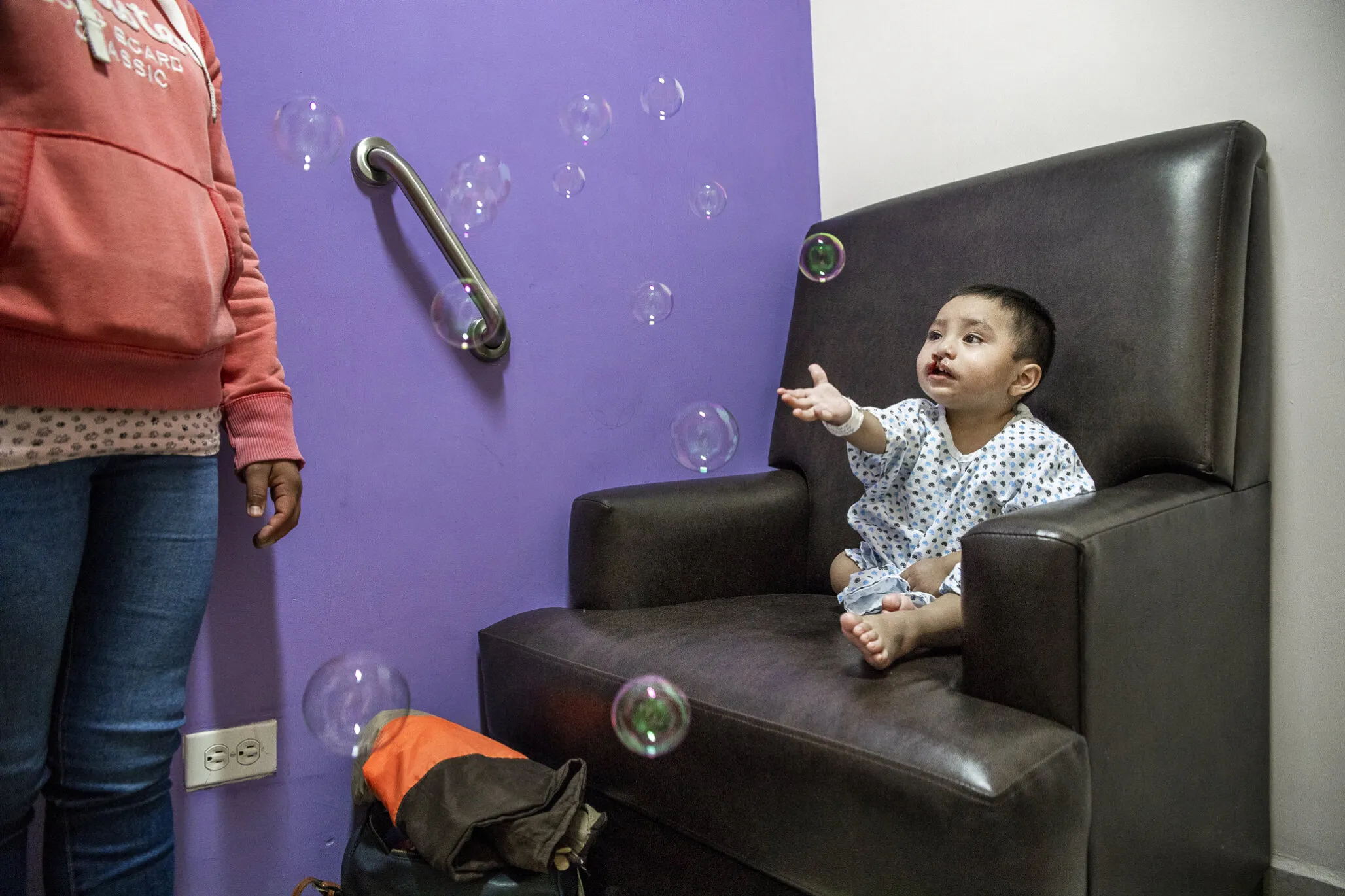 Sebastian waits patiently while wearing his surgical gown during a program in Puebla, Mexico.