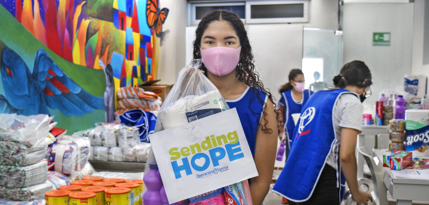 A student prepares bags for Sending Hope