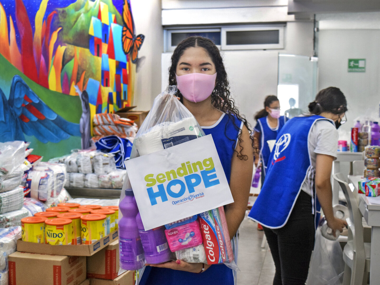 A student holds a bag as part of Sending Hope.