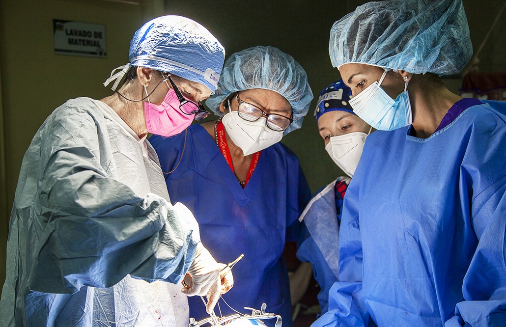 Dr. Laura Melloni, cleft surgeon of Mexico, left, performs surgery during Operation Smile's June 2022 Women in Medicine surgical program in Lima, Peru.