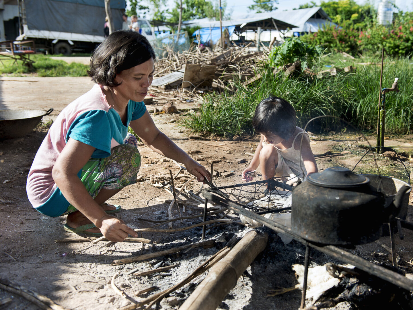 Loraine helps to cook in the Philippines.