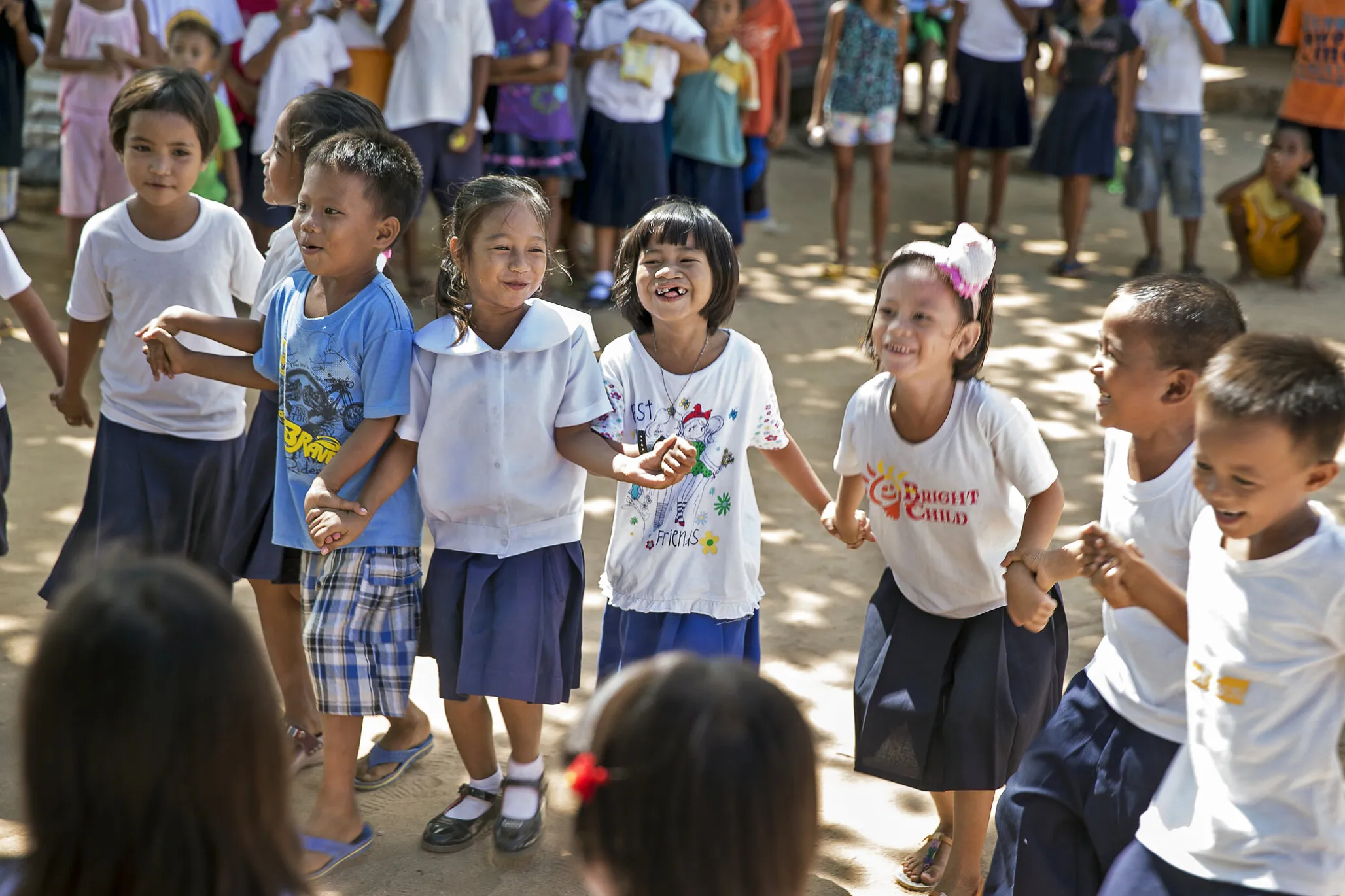 Loraine, after surgery, plays with friends.