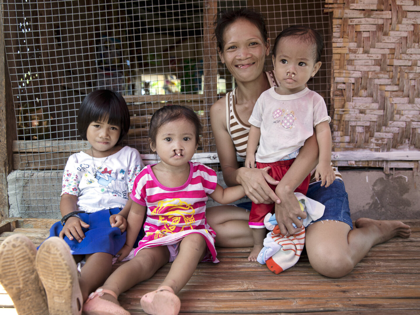 Loraine, after surgery, sits with friends and family.