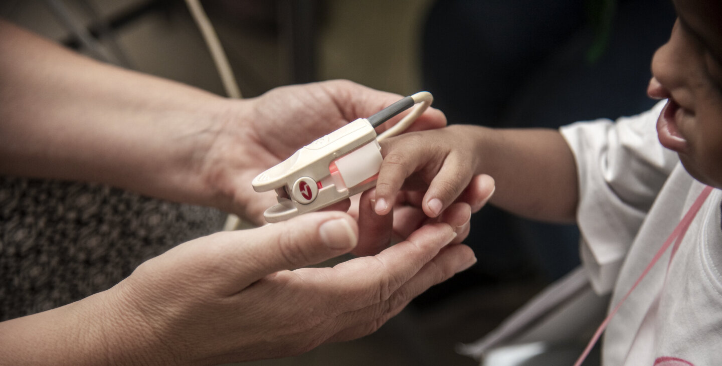Volunteers treat a patient during the Women in Medicine surgical program in 2022.