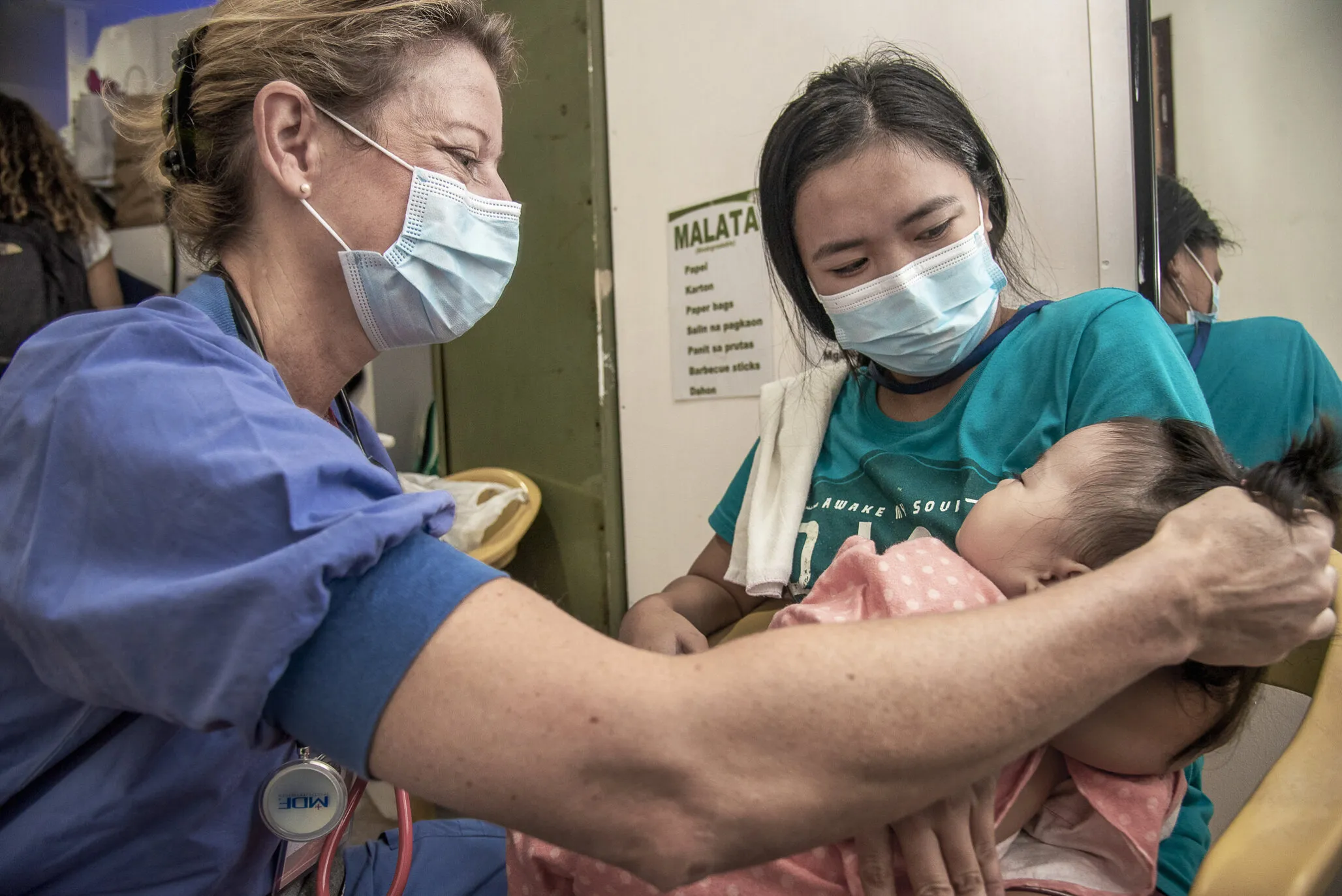 A pediatrician treats a patient during the Women in Medicine surgical program in 2022.