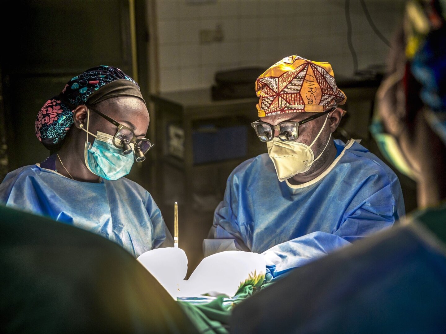 Dr. Charles Furaha and Dr. Francoise Mukagaju perform surgery during a program in 2021 in Rwanda.