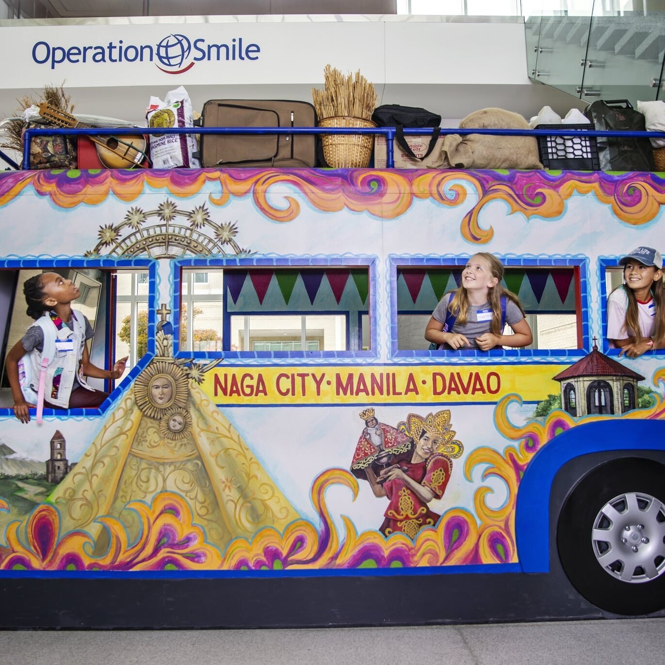 Children explore the jeepney at the Interactive Learning Center in Operation Smile headquarters in Virginia Beach, Virginia.