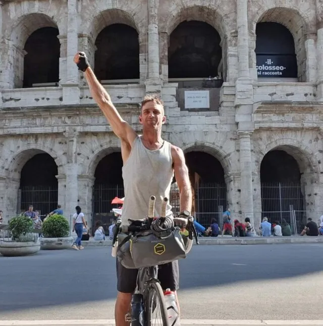 Dan Meyer poses with his bike after completing his European Smile Cycle.