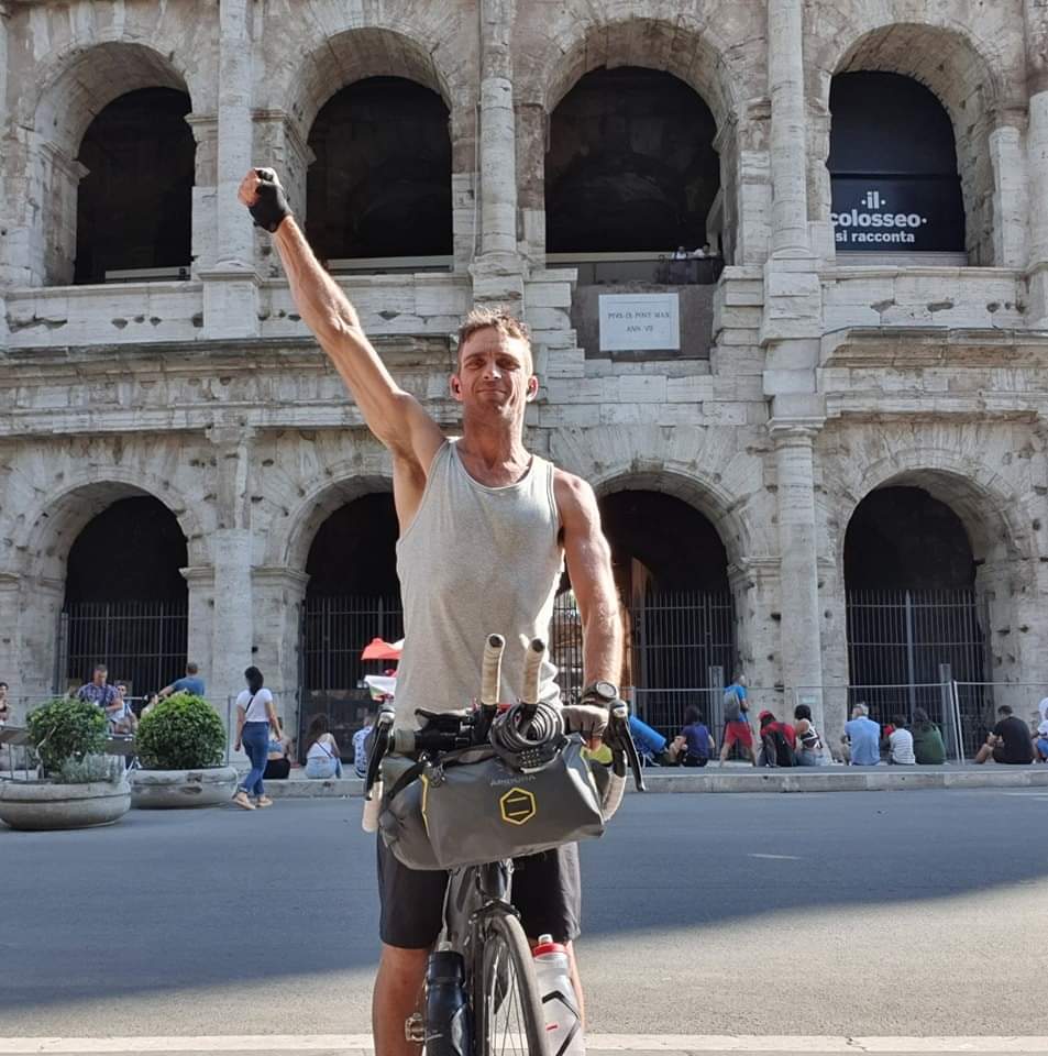 Dan Meyer poses with his bike after completing his European Smile Cycle.