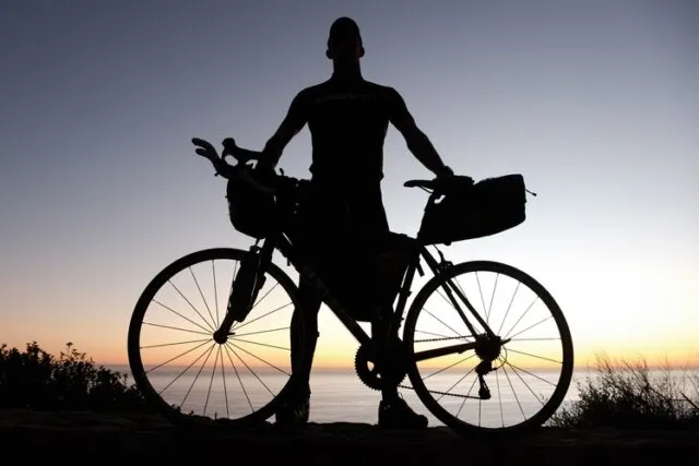 Dan Meyer stands with his bike.