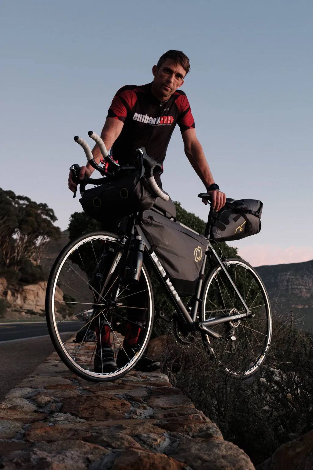 Dan Meyer stands with his bike.