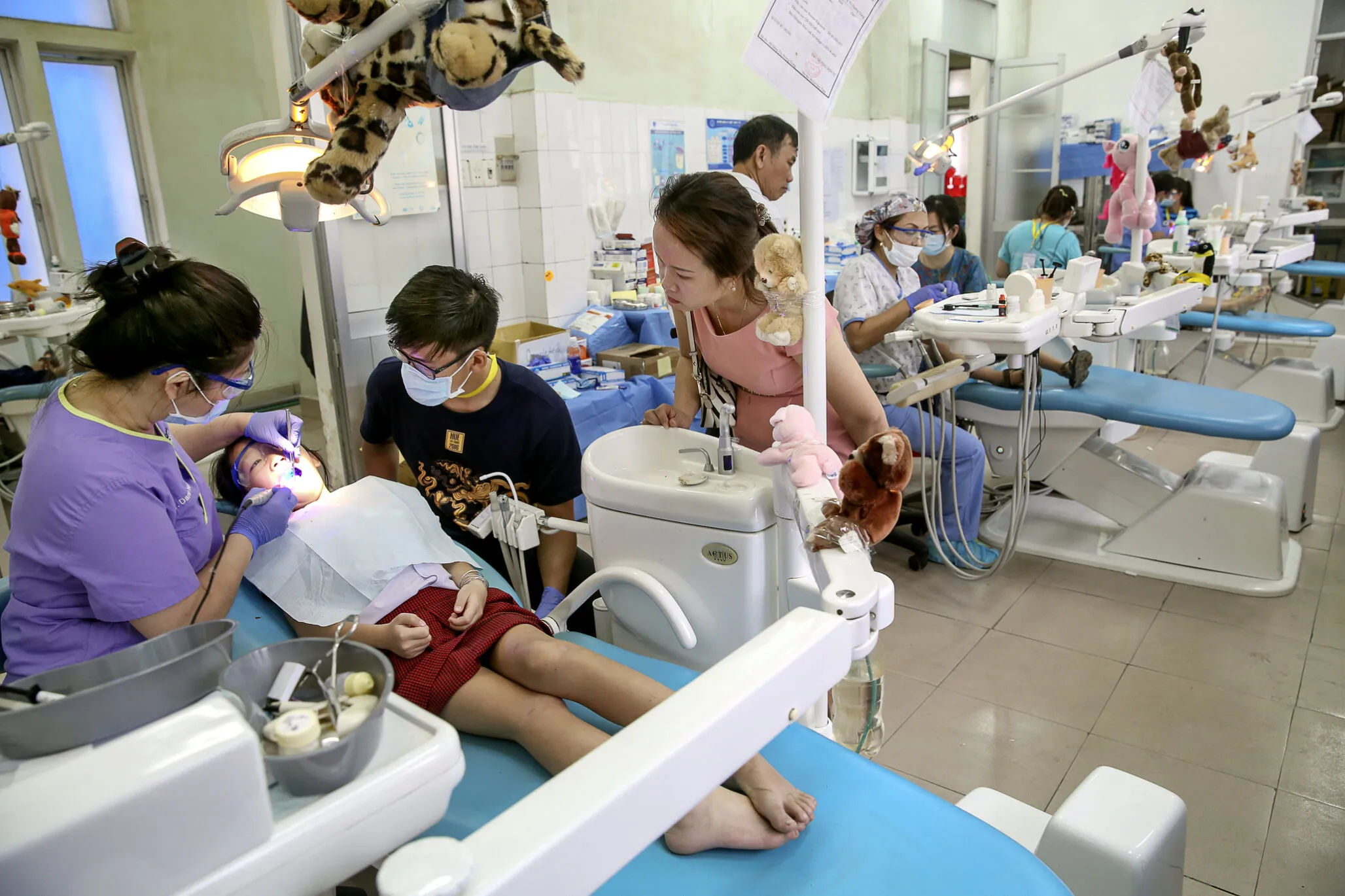 Dr. Dane Hoang provides a patient with dentistry during the 2016 Operation Smile dental program at Hue Odonto-Stomatology Hospital in Hue, Vietnam.