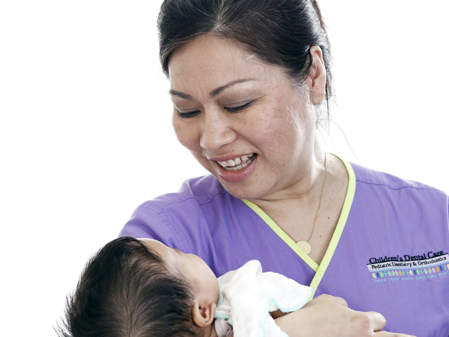 Dr. Dane Hoang comforts a young patient during the 2016 Operation Smile dental program at Hue Odonto-Stomatology Hospital in Hue, Vietnam.
