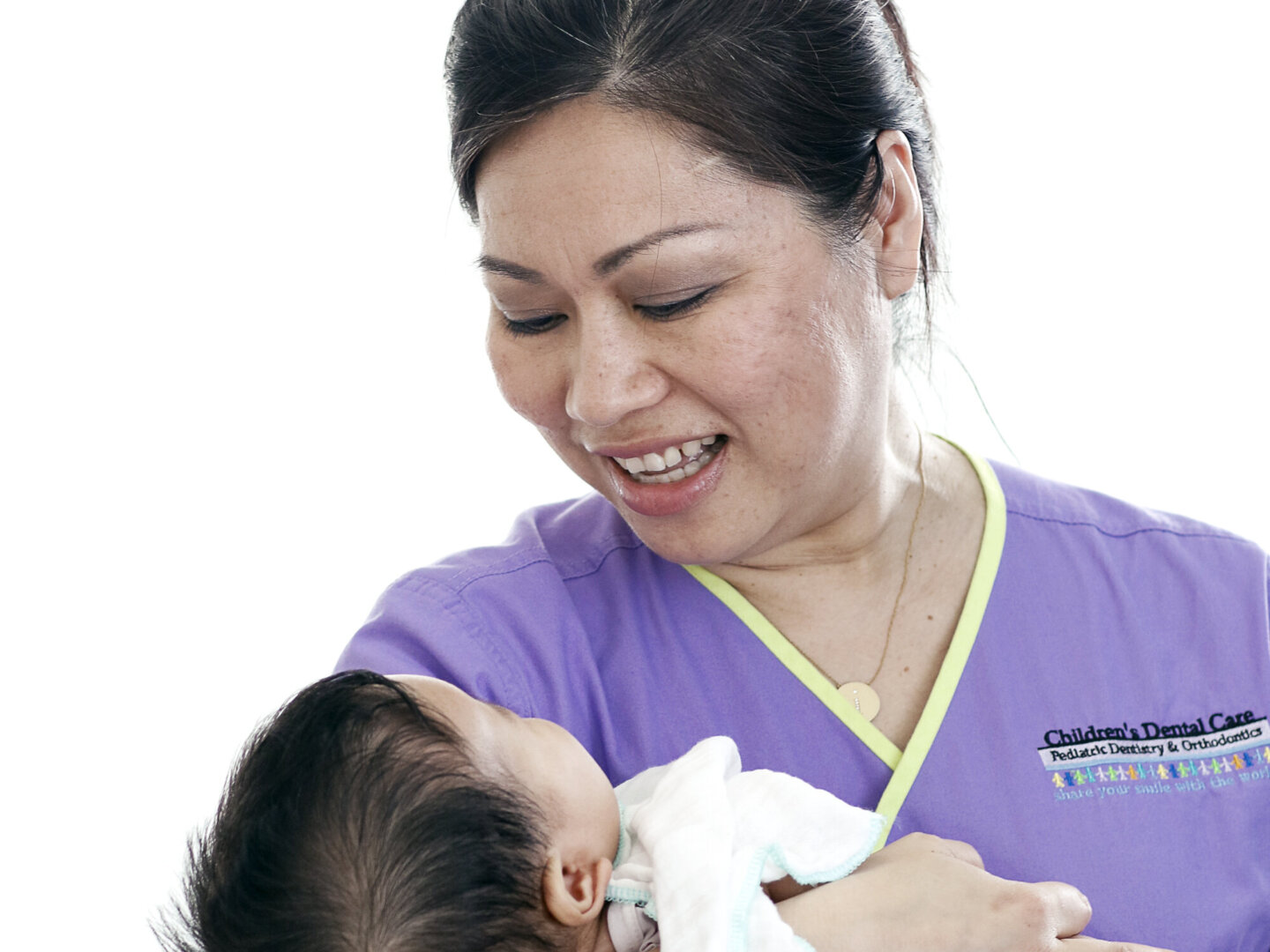Dr. Dane Hoang comforts a young patient during the 2016 Operation Smile dental program at Hue Odonto-Stomatology Hospital in Hue, Vietnam.