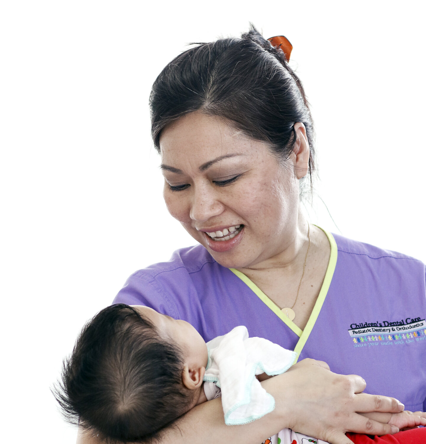 Dr. Dane Hoang comforts a young patient during the 2016 Operation Smile dental program at Hue Odonto-Stomatology Hospital in Hue, Vietnam.