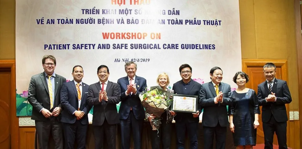 Operation Smile Co-Founders Bill and Kathy Magee smile with members of the Vietnam Ministry of Health.