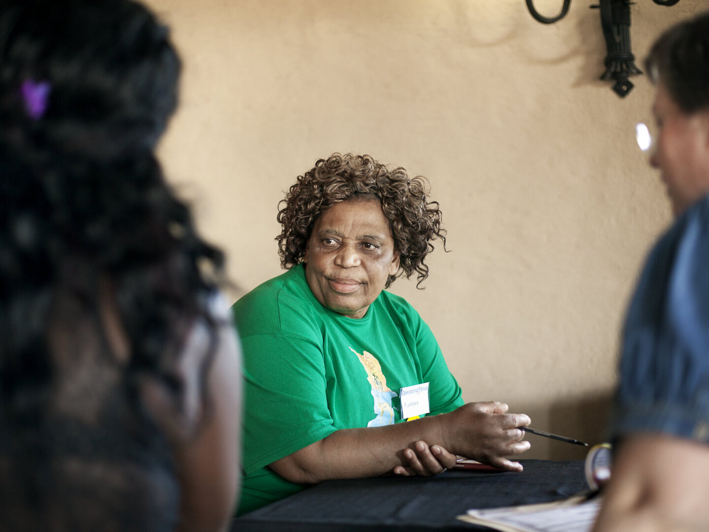 Nurse Funeka Cele speaks with families.