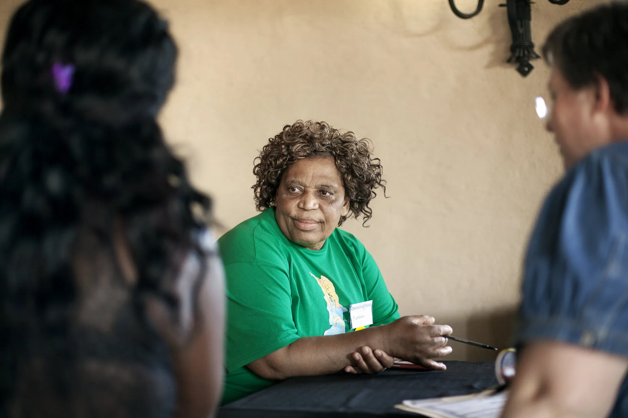 Nurse Funeka Cele speaks with families.