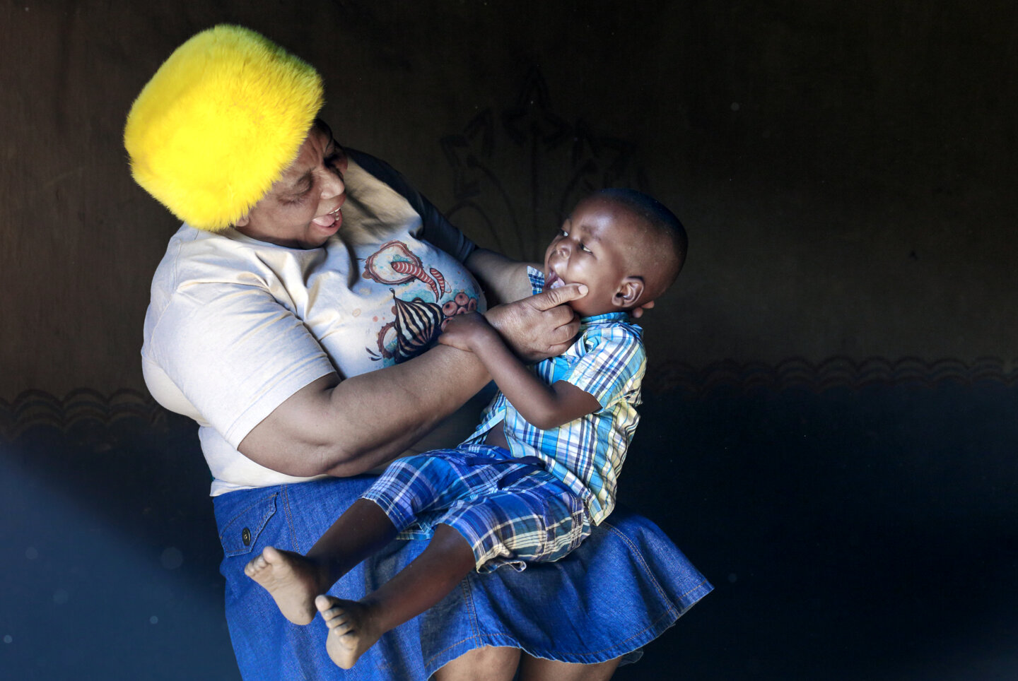 Nurse Funeka Cele examines a patient in South Africa.