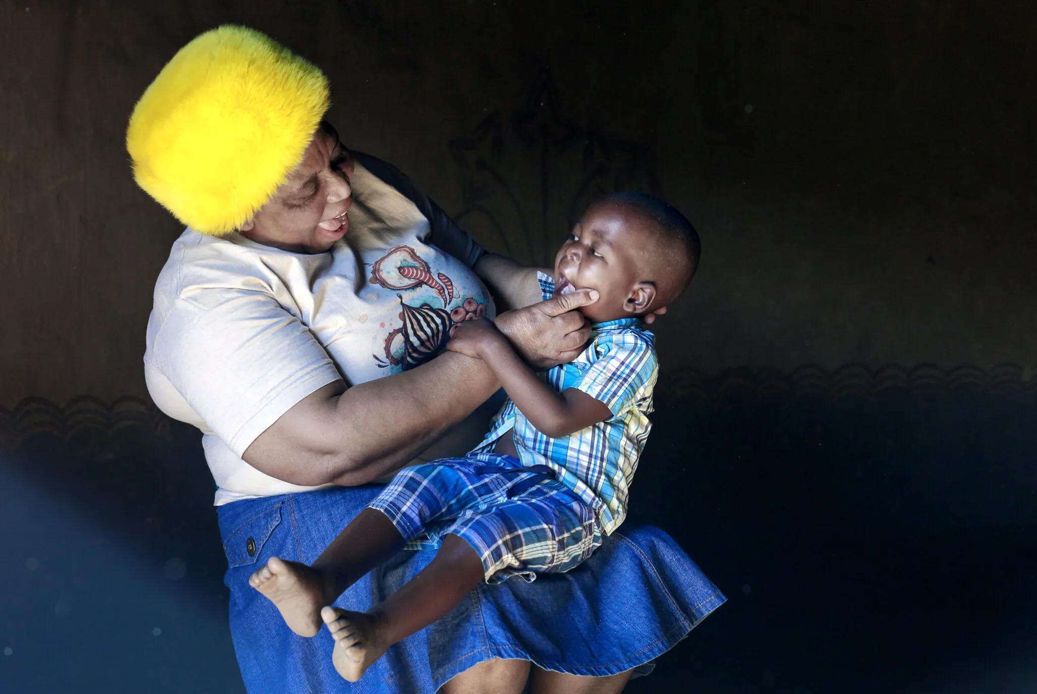 Nurse Funeka Cele examines a patient in South Africa.