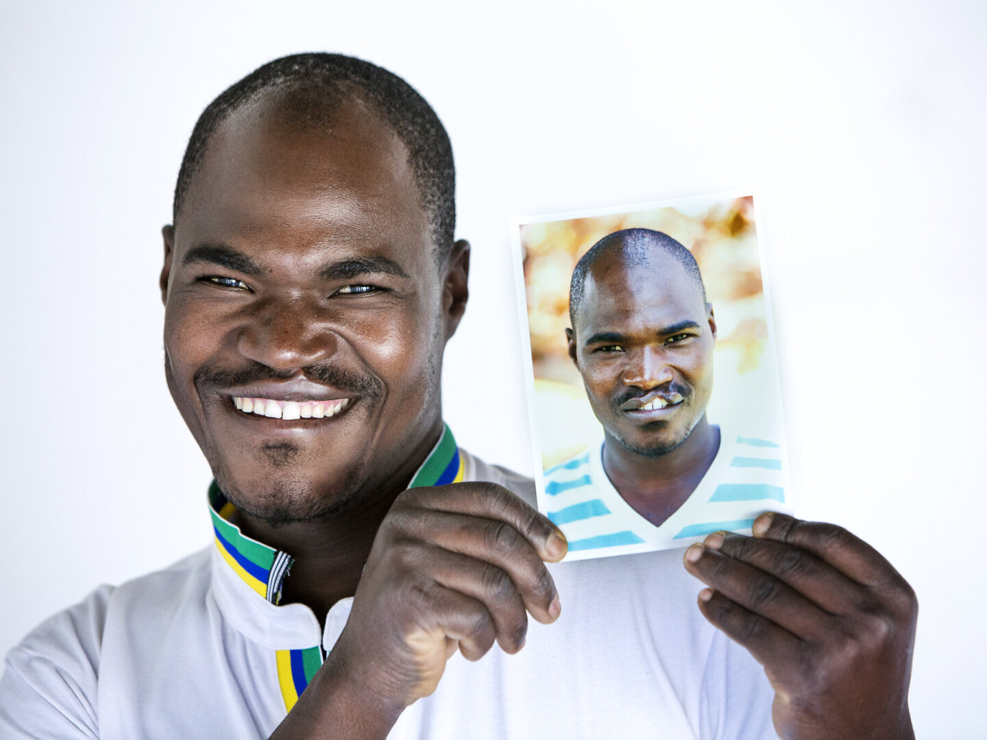 Ephraim poses with his before photo.