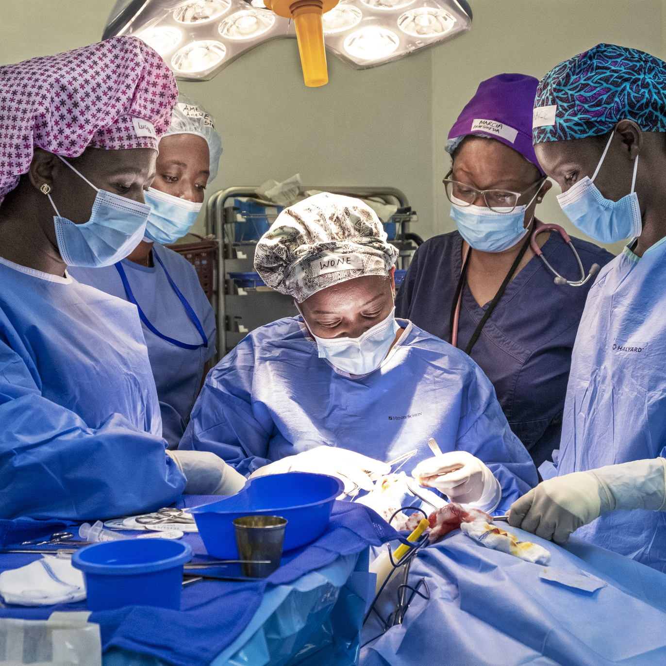 In the operating room during a Women in Medicine surgical program, cleft surgeon Dr. Wone Banda, center; surgical scrub personnel, Lucy Dodoli, left; pre- and post-operative nurse Grace Chirwa, right; and anesthesiologist Dr. Amelie Kamagaju, back left, working together as an all-female surgical team