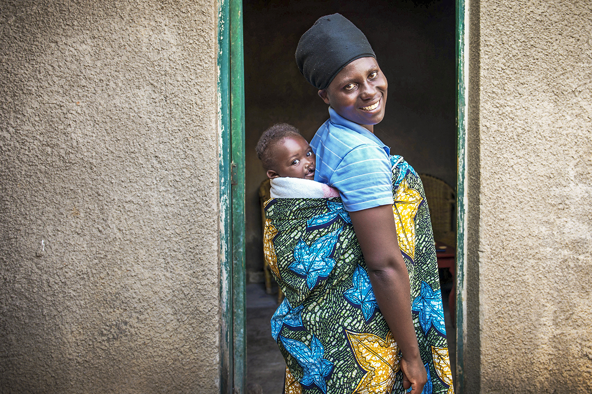 Adolphe and his mom smile for the camera.