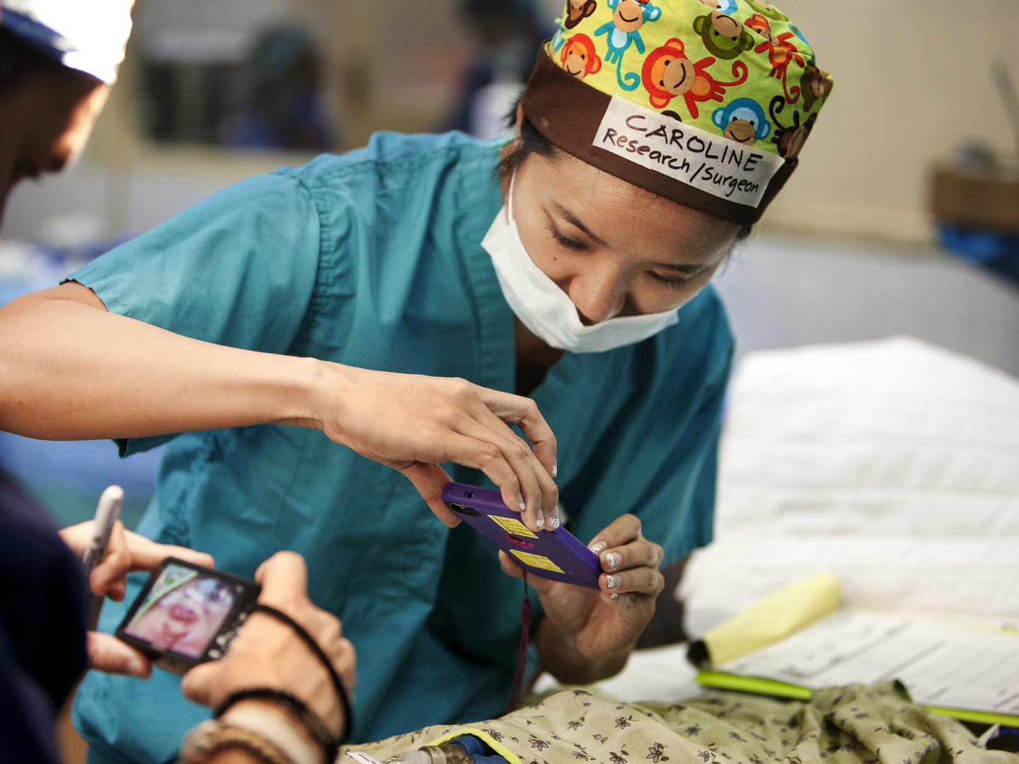 Dr. Caroline Yao takes a photo of a patient during a surgical program in Vietnam.