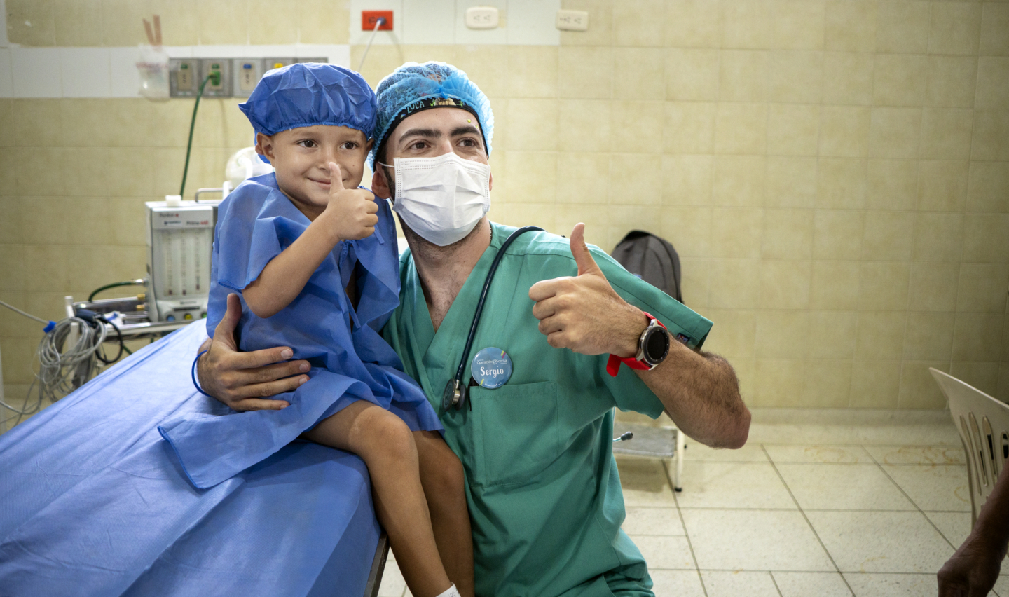 An anesthesiologist poses with his patient during a surgical program in Colombia.