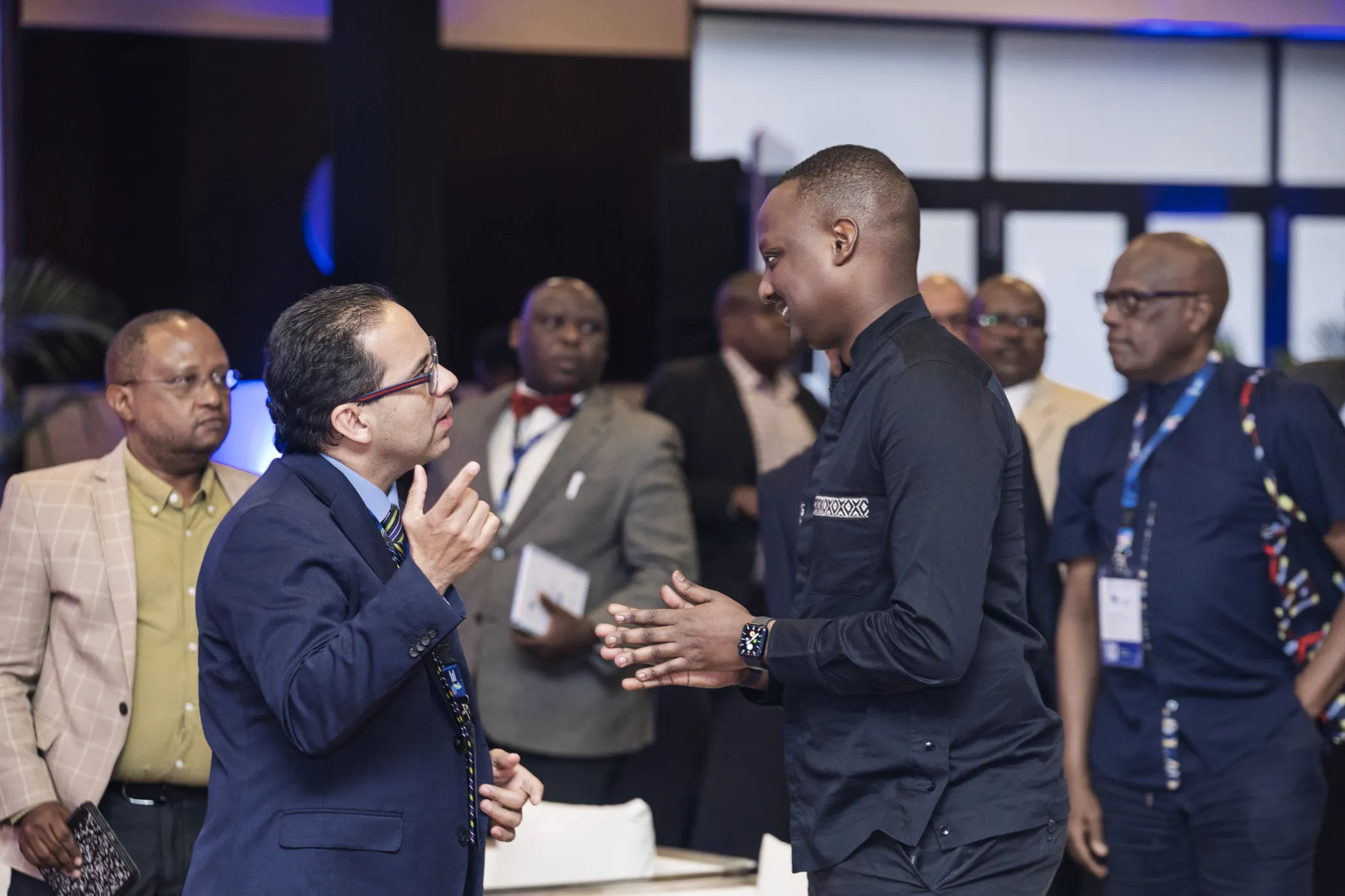 Dr. Ruben Ayala speaks with a participant at the 2025 Pan-African Surgical Conference.