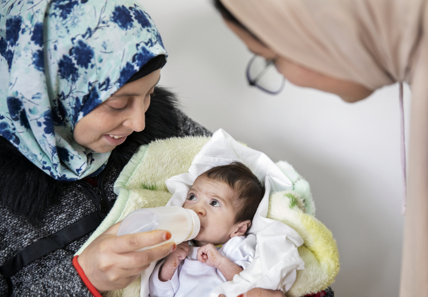 For perhaps the first time, Fatima watches as Janat drinks milk without choking thanks to her daughter’s new feeding plate.